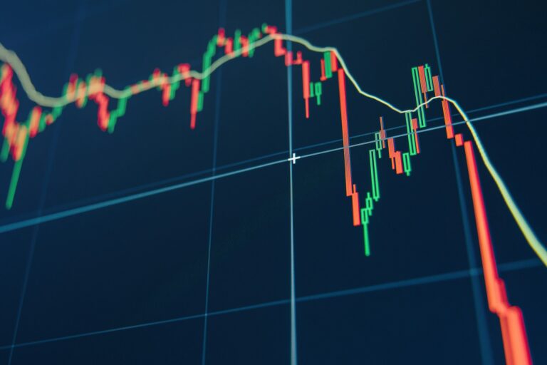 Diagram representing red crashing market volatility of crypto trading on blue display background