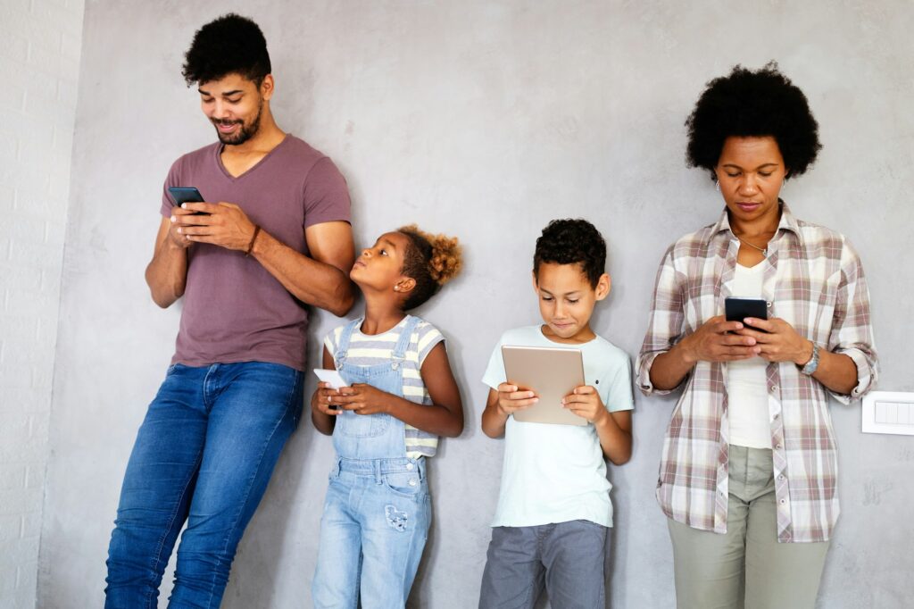 Family sharing there privacy data by using digital devices, phones, tablets