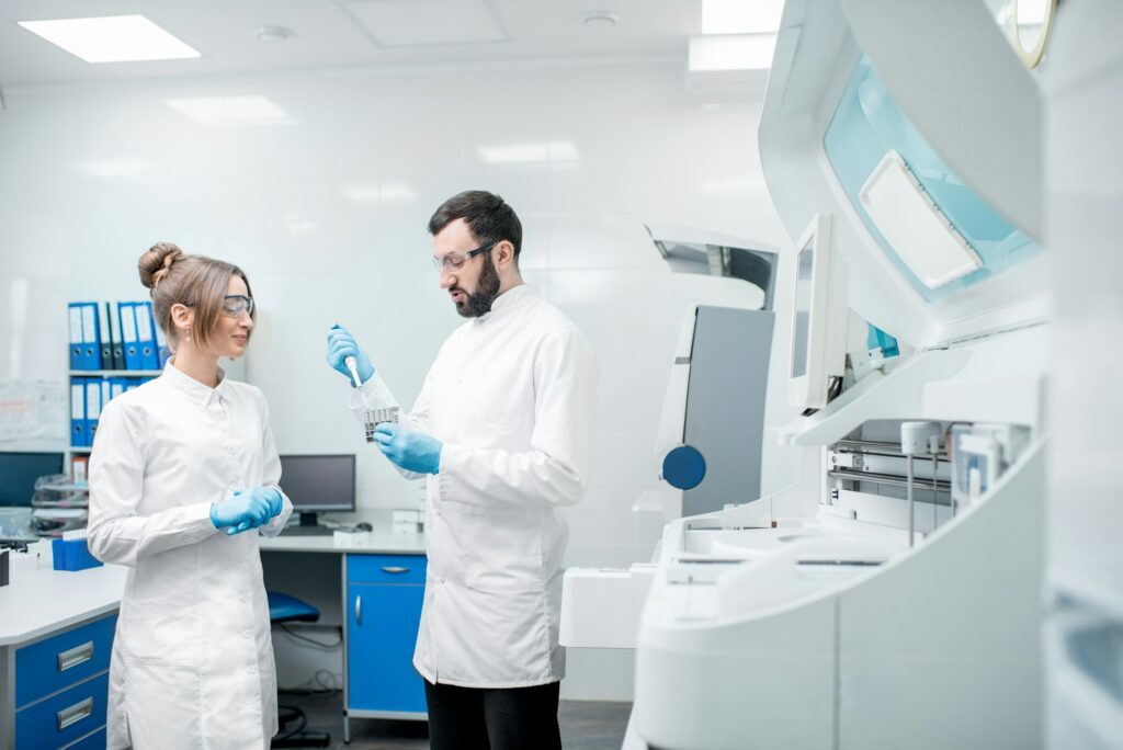 Laboratory assistants workign with test tubes