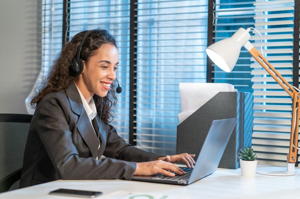 Latino beautiful business woman call center smile while work in office.