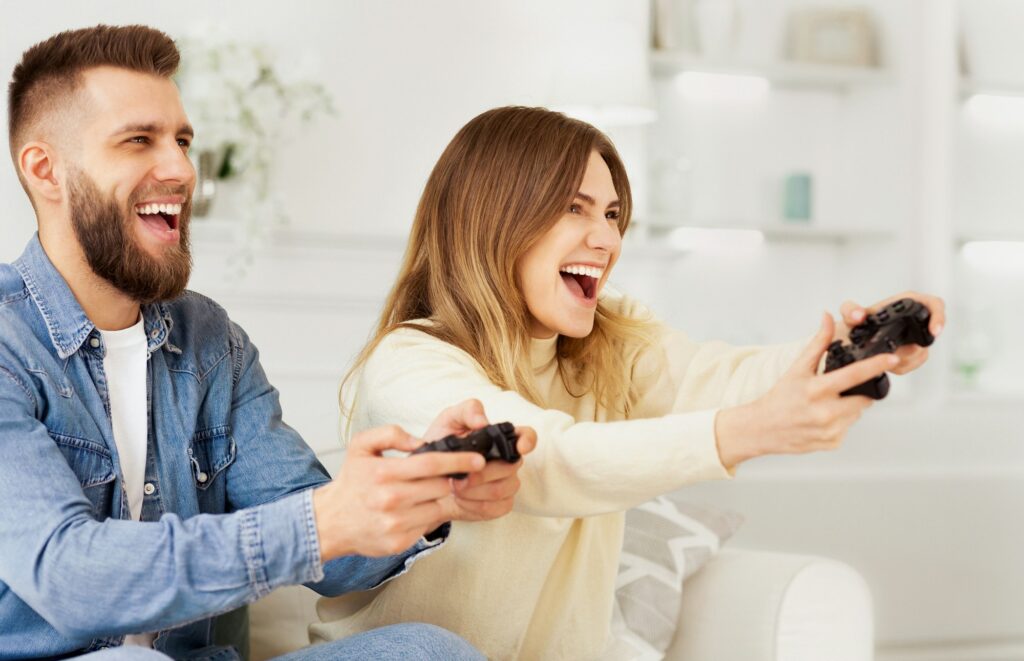 Man and Woman Engaged in Video Game Competition