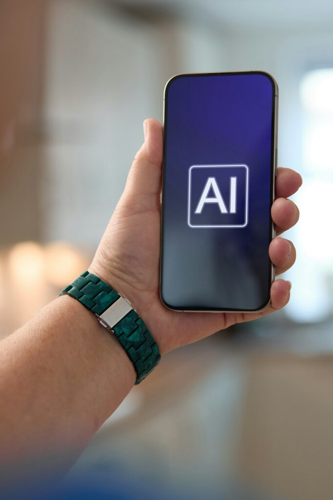 Person Holding Smartphone Displaying AI Interface in Modern Indoor Setting