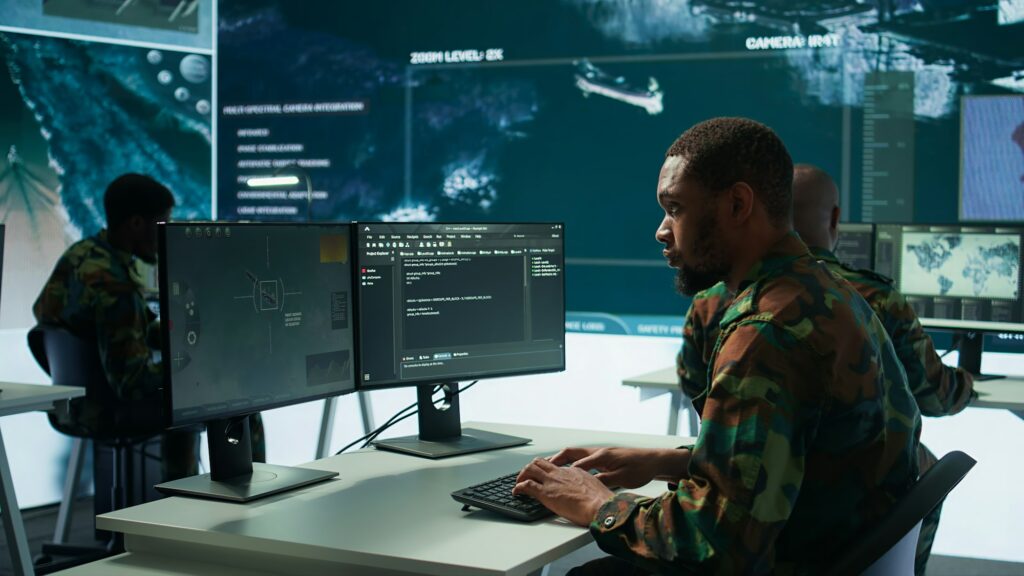 Soldier working with AI intelligence on pc in control room