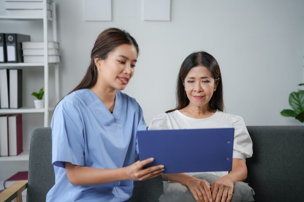 Young doctor explaining medical test results to senior patient