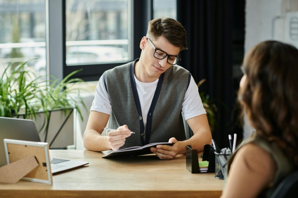 Colleagues Engaging in Difficult Conversations During Layoff Discussions at Workplace