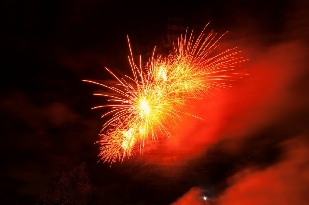 Fireworks light up close-up against dark sky