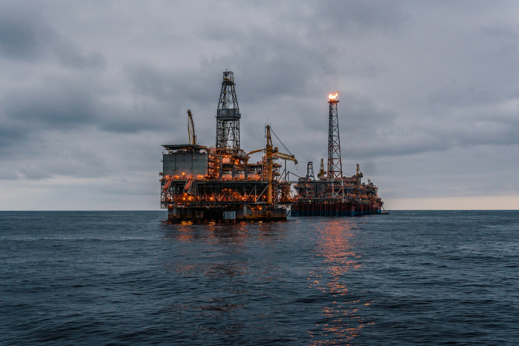 FPSO tanker vessel near Oil Rig platform. Offshore oil and gas industry