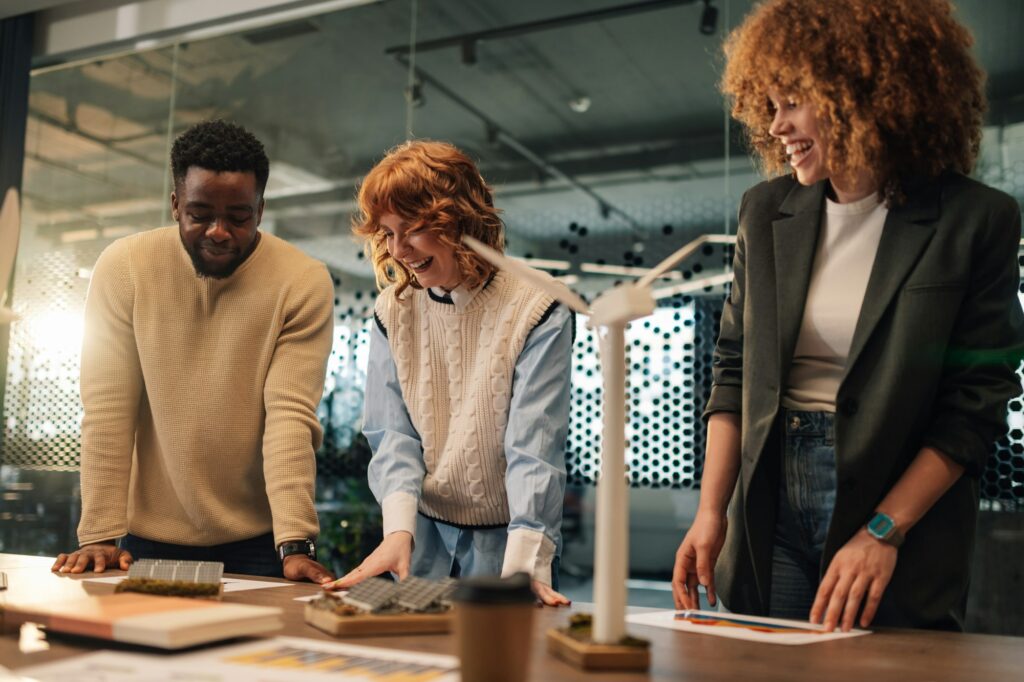 Interracial ecology engineers developing renewable energy implementation