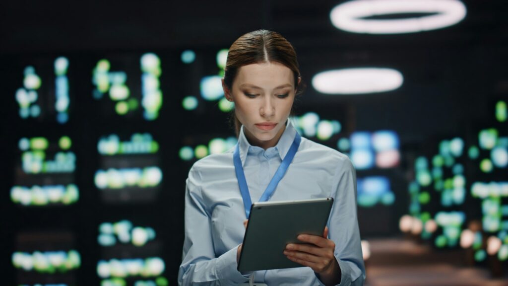 IT woman working tablet at datacenter closeup. Lady typing pad computer screen