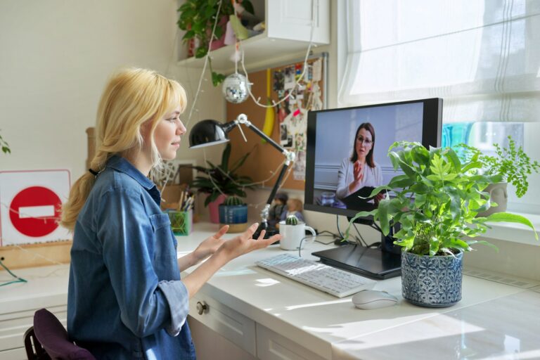 Teen girl talking online with psychologist, social worker