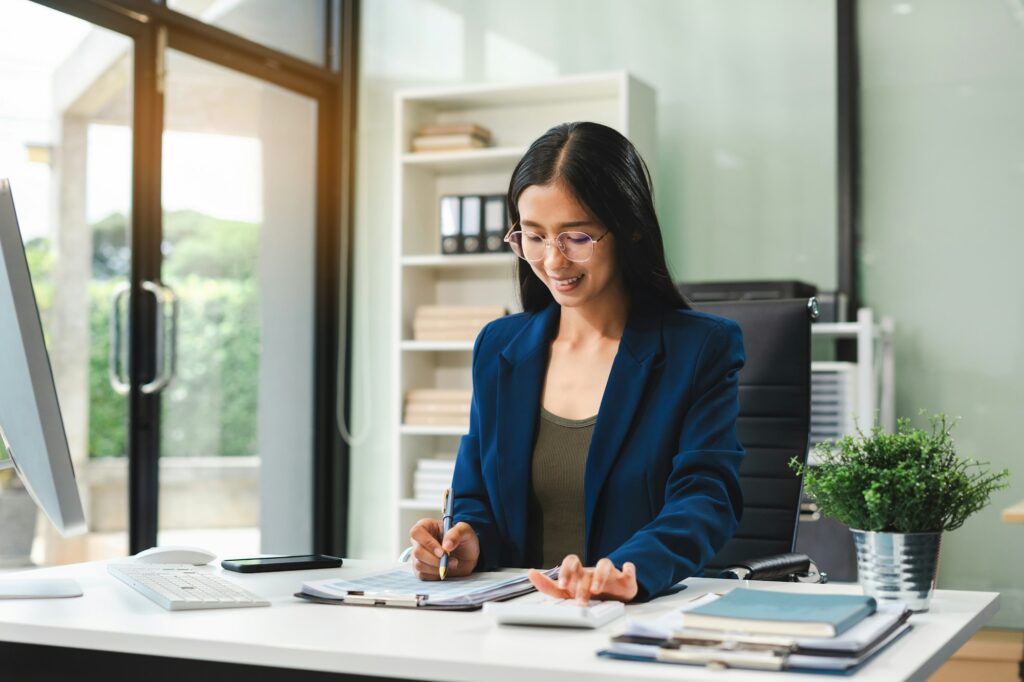 Business woman using digital tablet analyzes business data