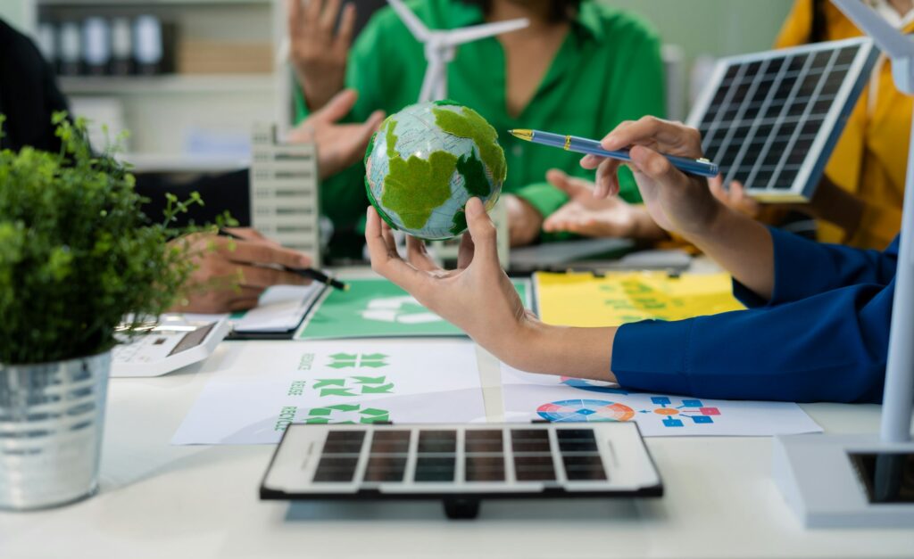 Businessman team using computer on CO2 emission reduction concept.