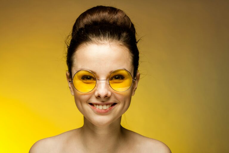 cheerful brunette naked shoulders yellow glasses emotions studio