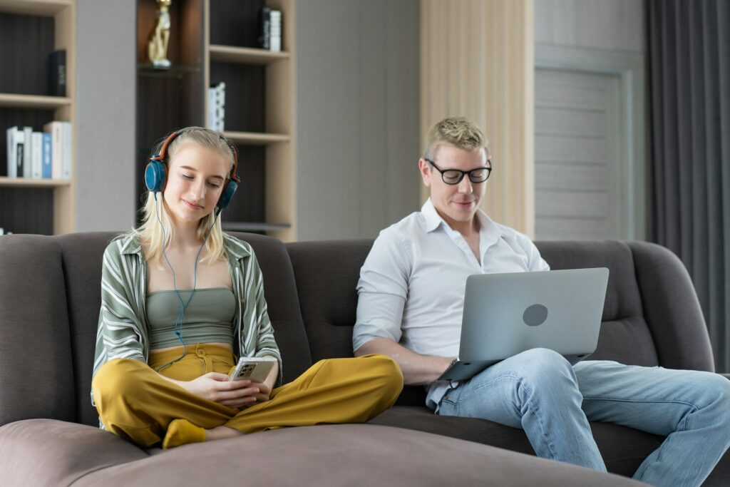 Girl listen to music with headphone relaxing in the living room