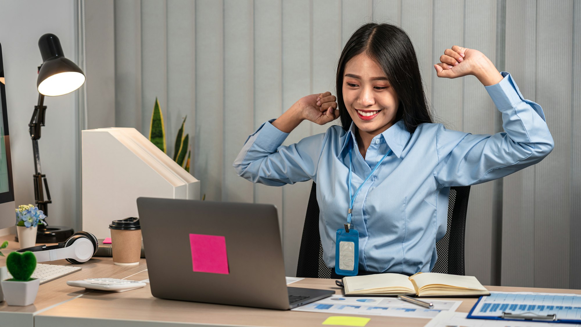 Secretary woman is raising arms to stretching for relaxing after sitting to work hard about summary