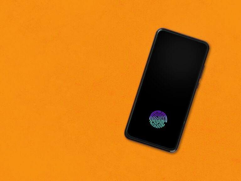 Smartphone with fingerprint on orange background