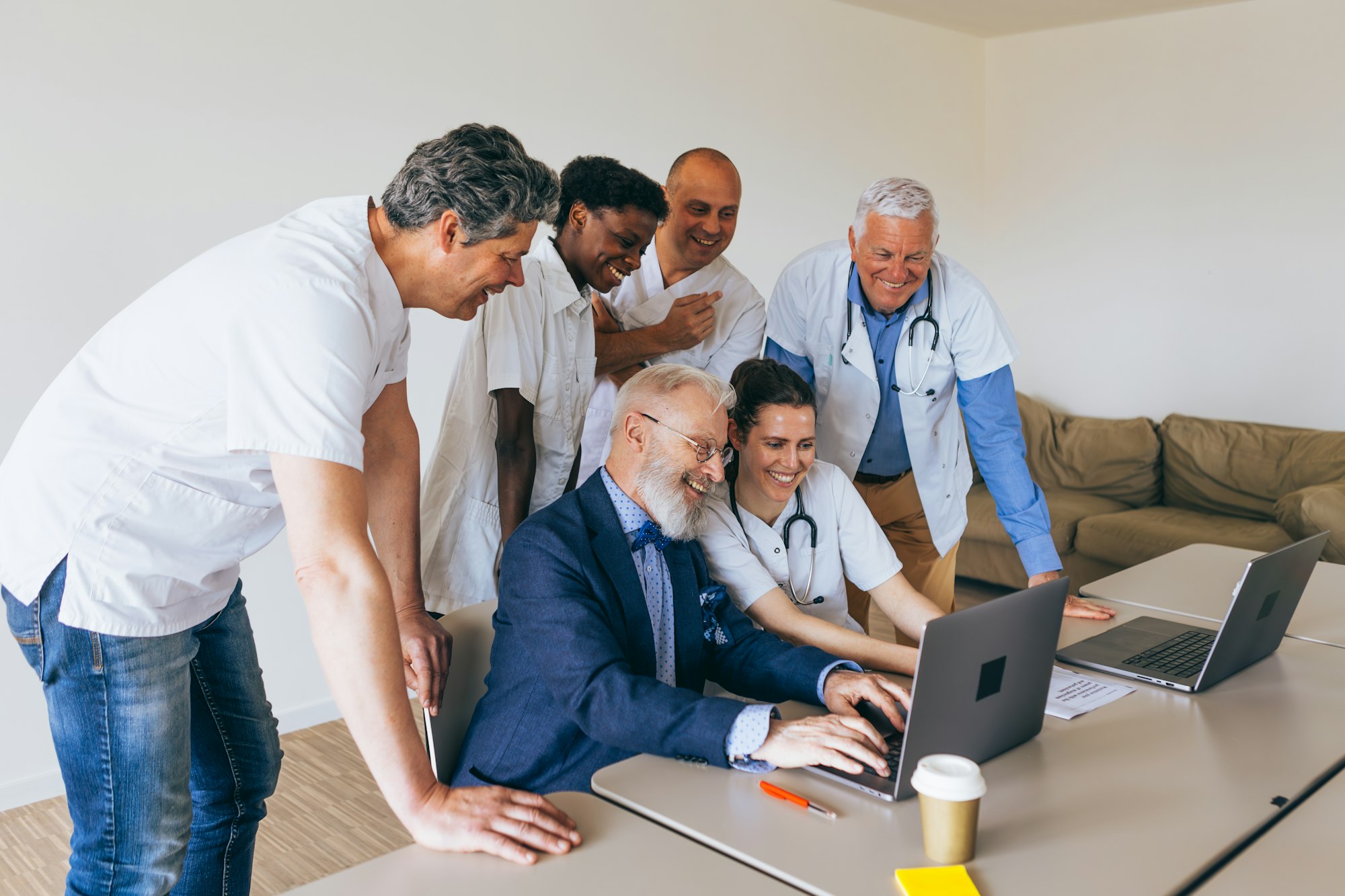 team of doctors examines and works on a common project