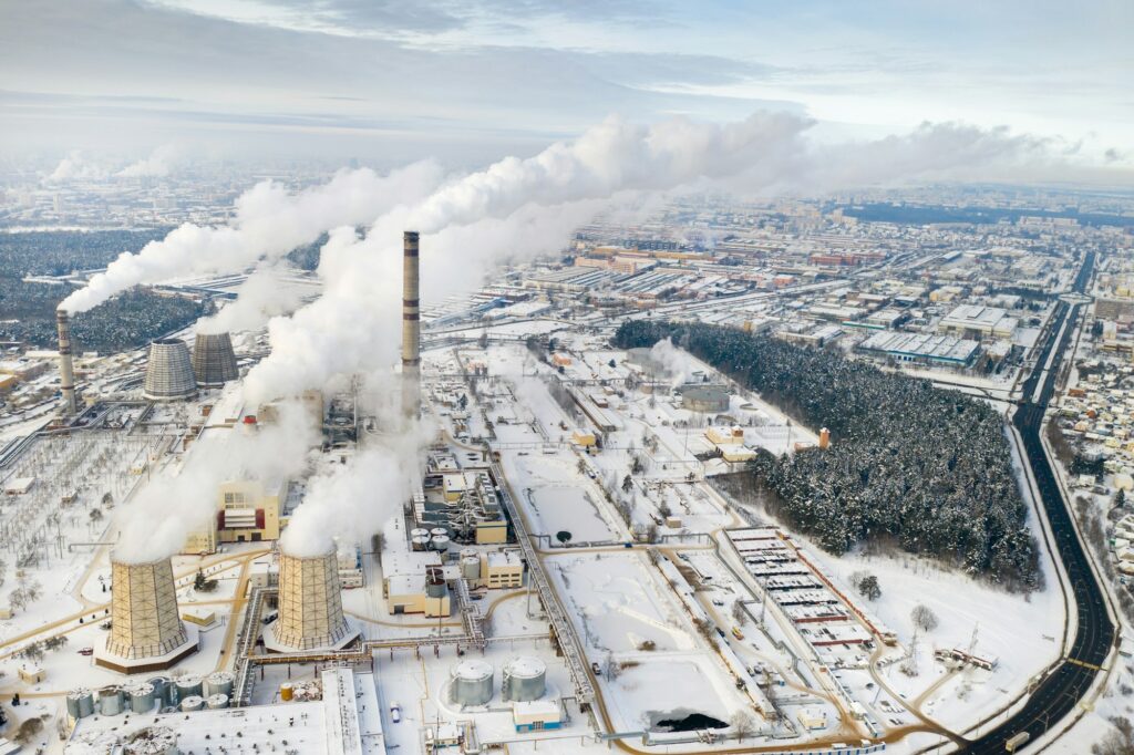 Thermal power plant in winter in the city of Minsk. Smoke is coming from the big Chimneys