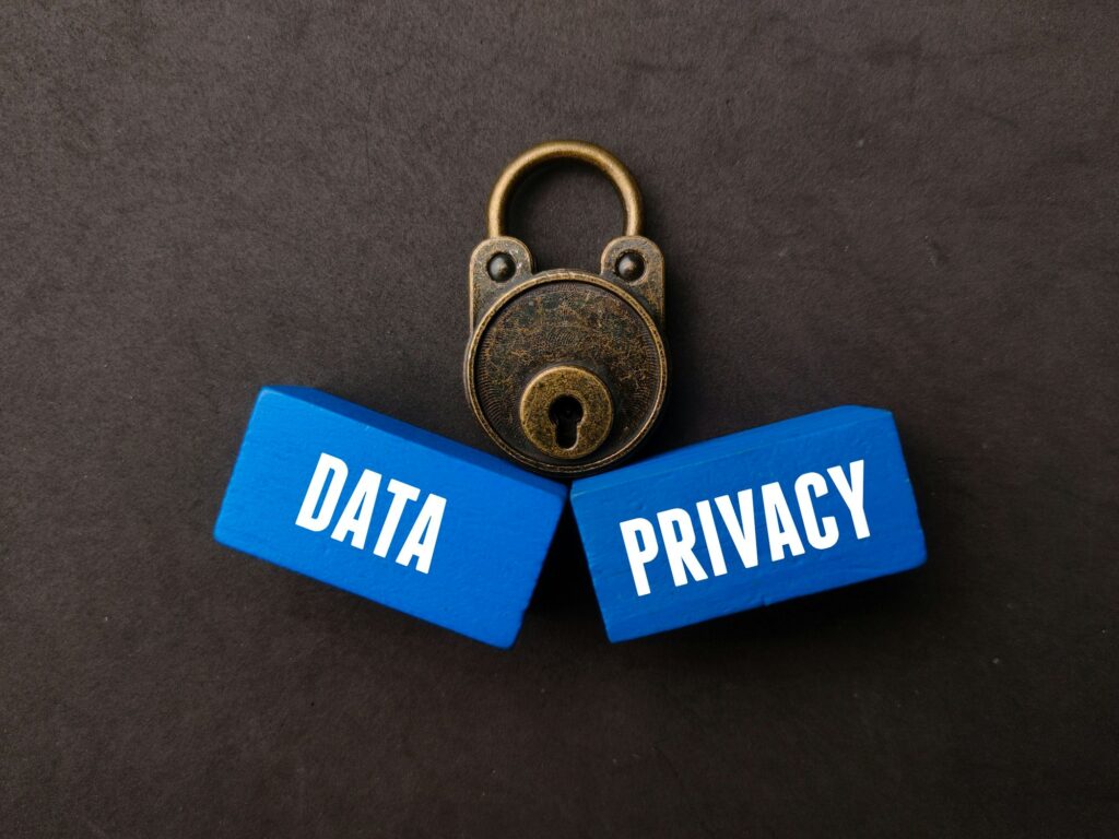 Vintage padlock and blue wooden cubes with the words DATA and PRIVACY