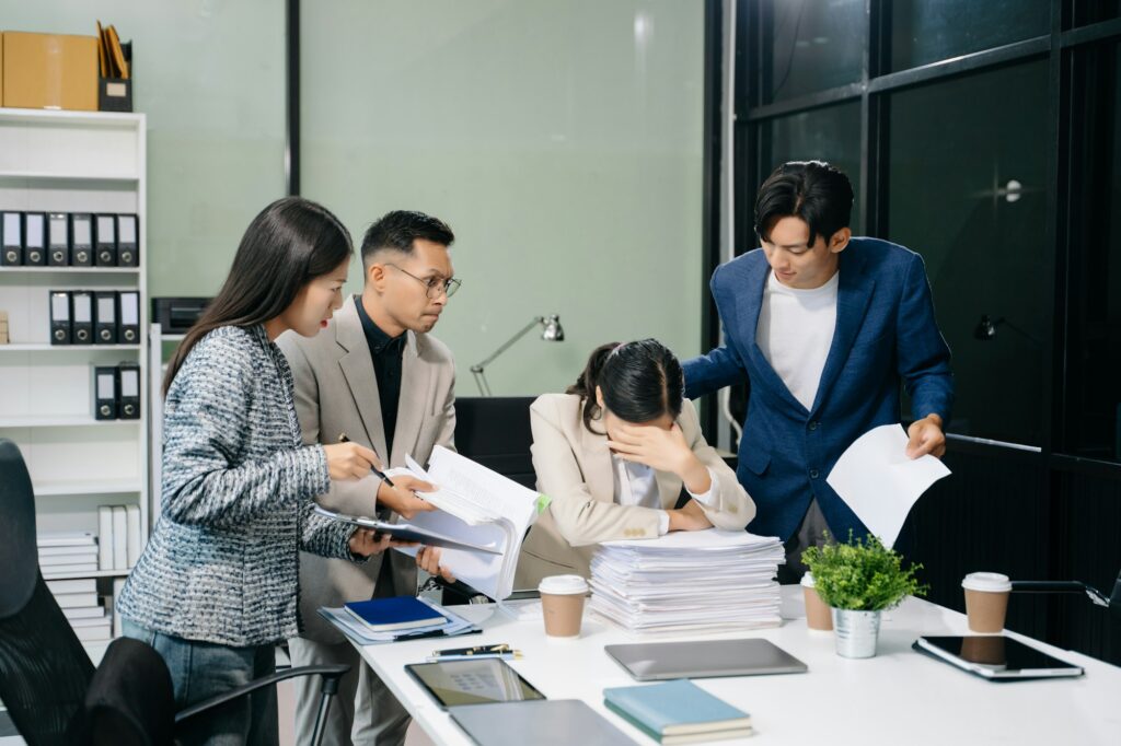 workplace stress and conflict with this intense scene of professionals in a heated office discussion