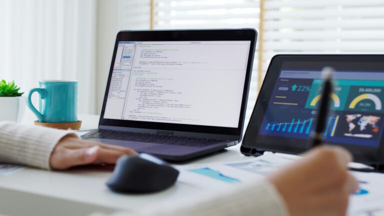 Back rear view of young asian woman, freelance data scientist work remotely at home