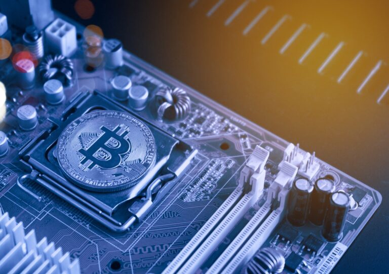 bitcoin coin on computer motherboard, Bitcoin mining and trading concept