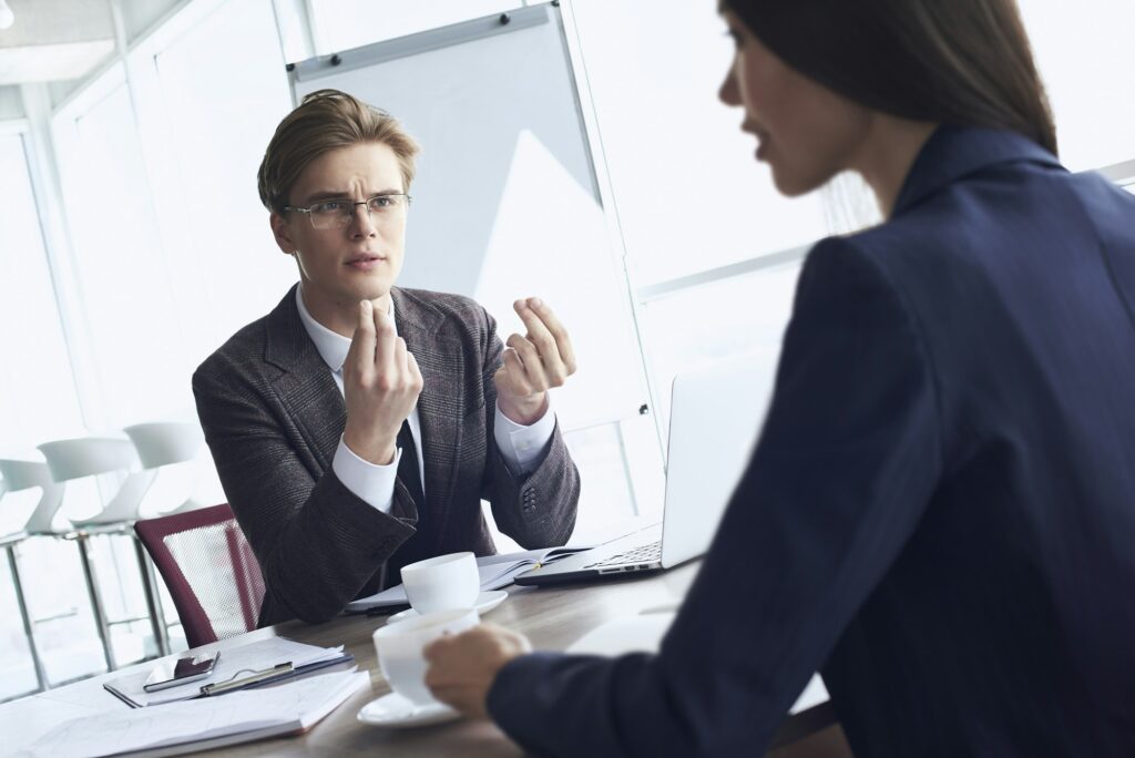 Businesspeople at office working together sitting discussing pro