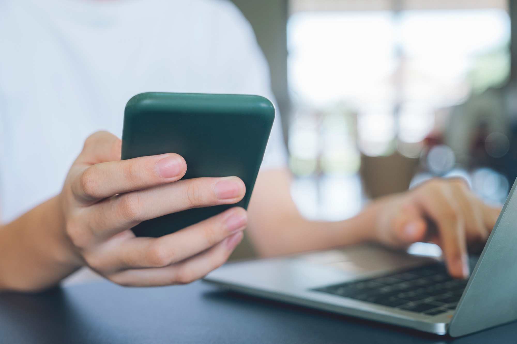 Close up of man using mobile phone.