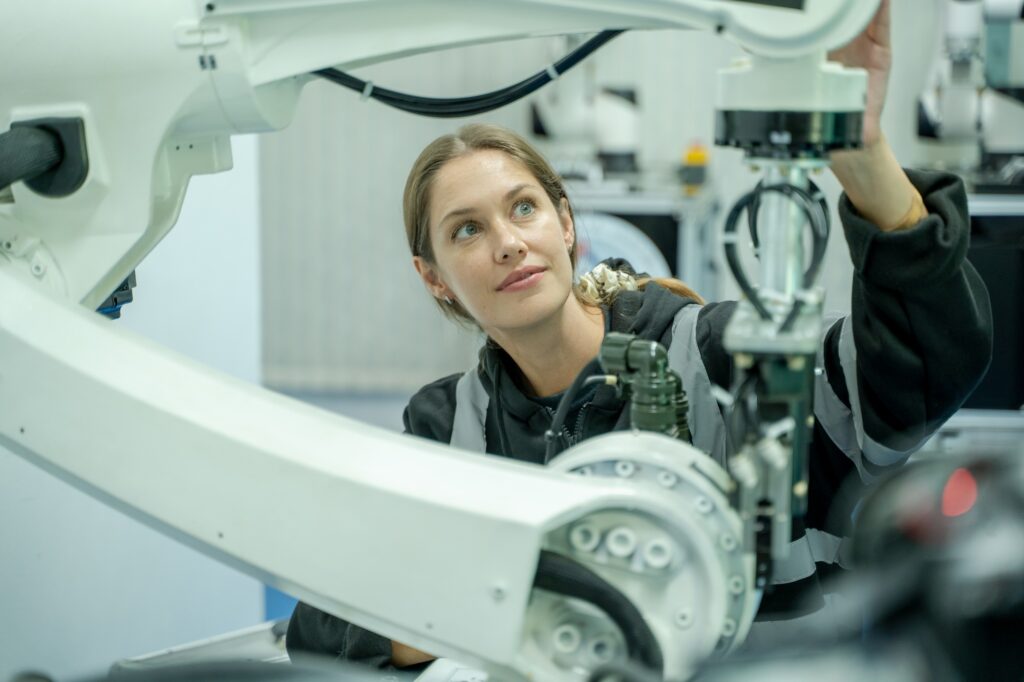 Engineer checking and operation robot arm at factory,Technology, automation.