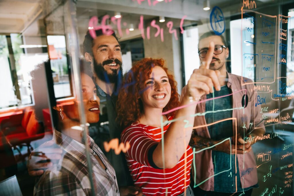 Happy software developers working on meeting, Programming advanced code artificial intelligence.