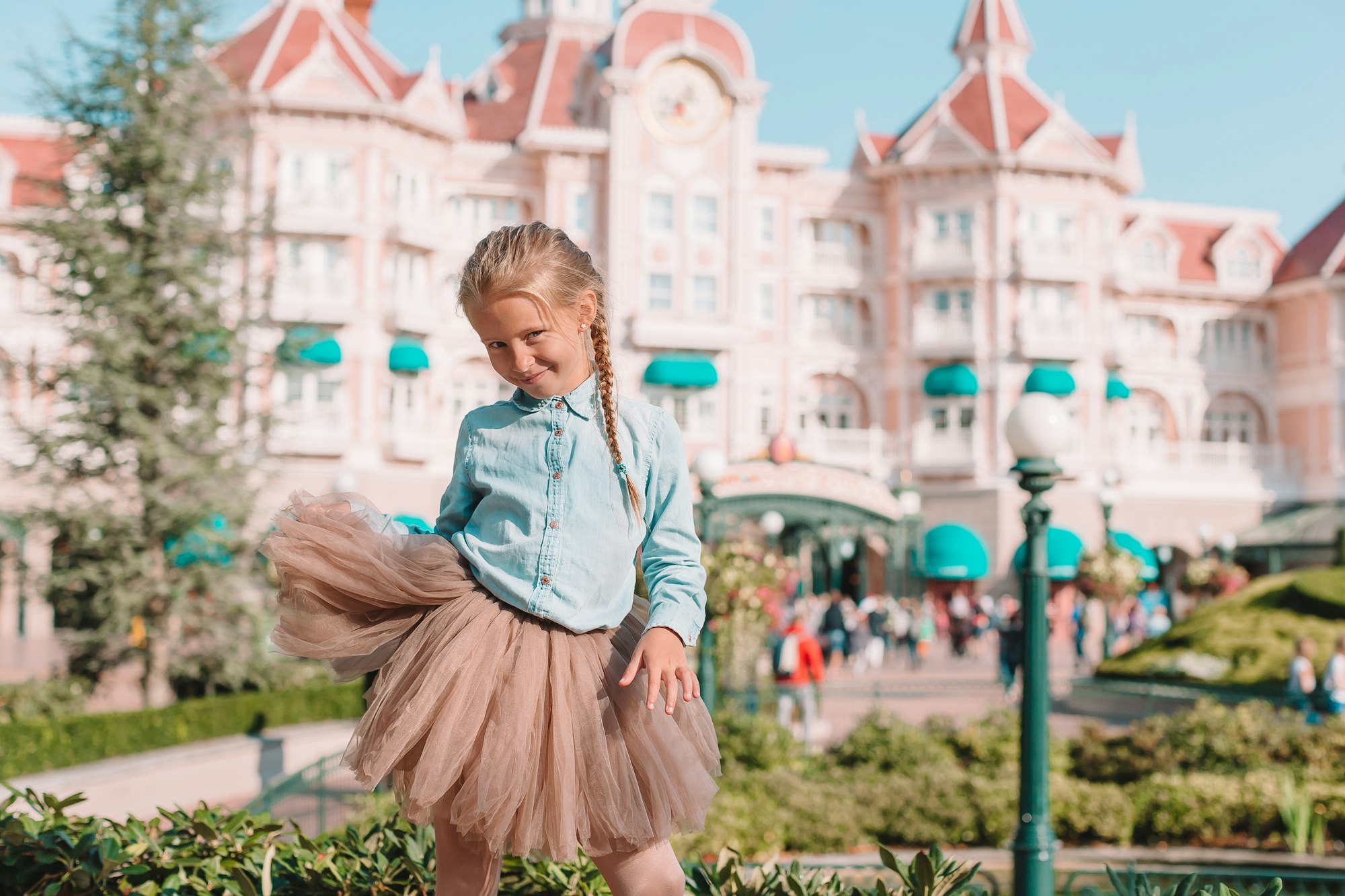 New Walt Disney AI Business Unit little adorable girl in cinderella dress at fairy tale disneyland park