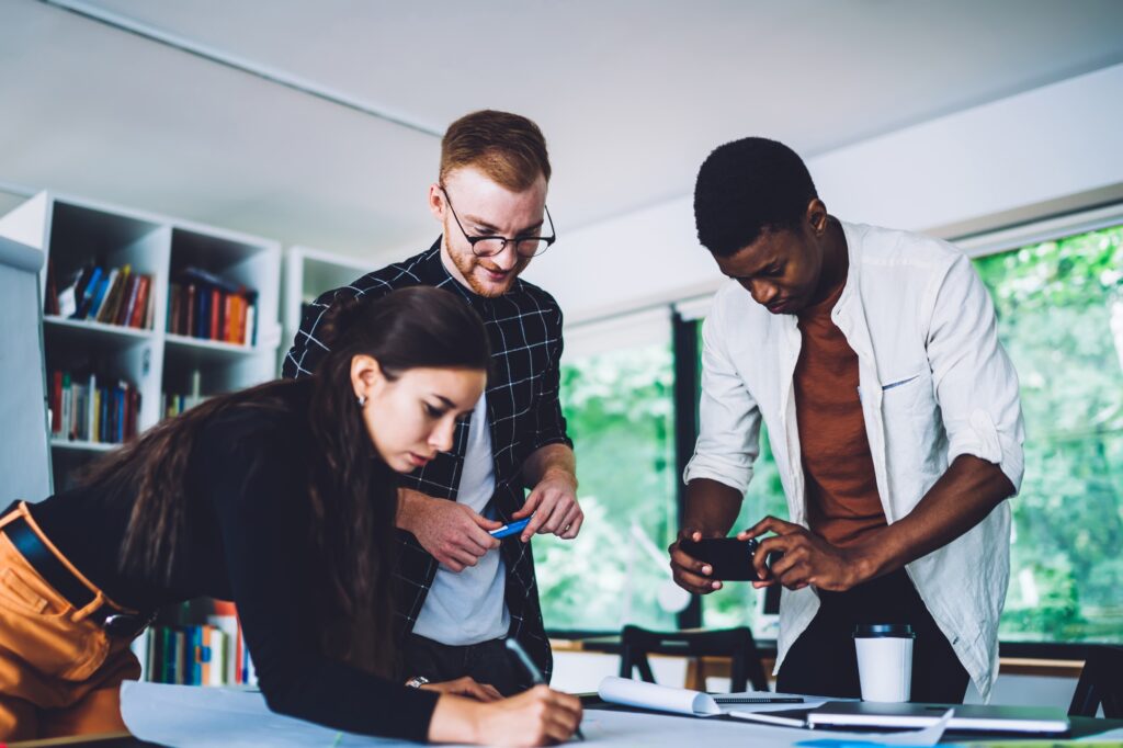 Multiracial business partners working with new project in office