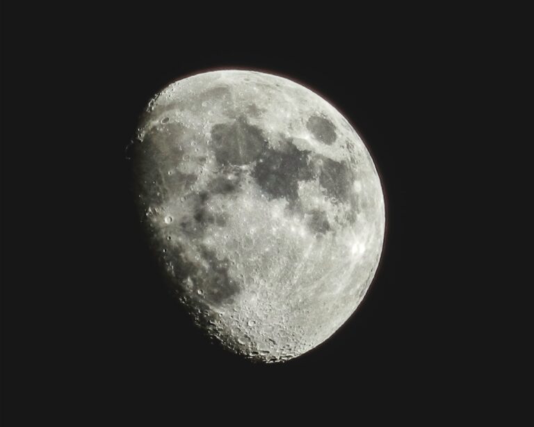 The moon is Earth's closest satellite, with vast lunar highlands (light) and lunar maria (dark).