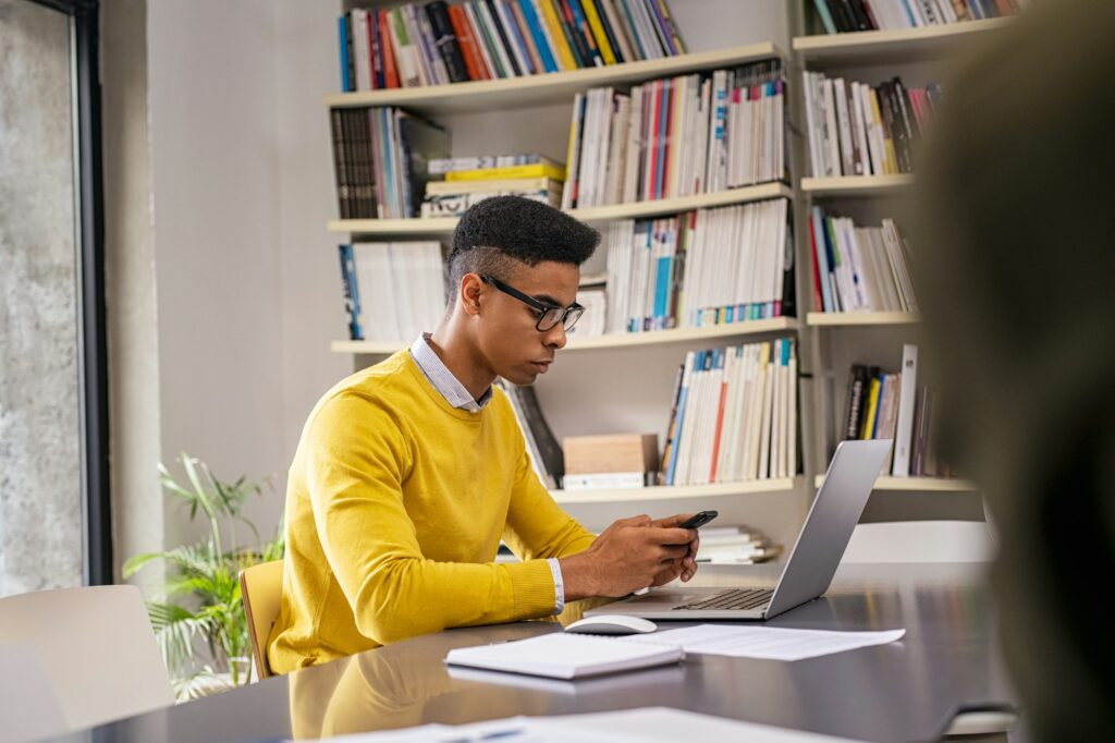 Young businessman using mobile phone