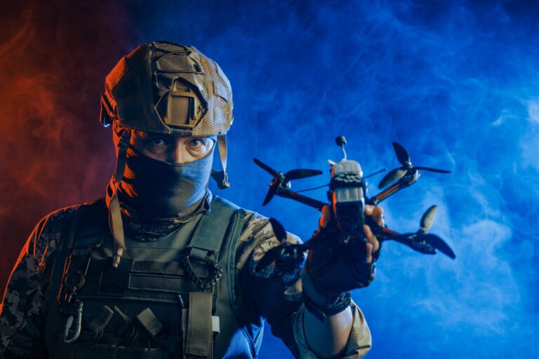 A soldier is depicted holding a drone while wearing stealth gear for military operations