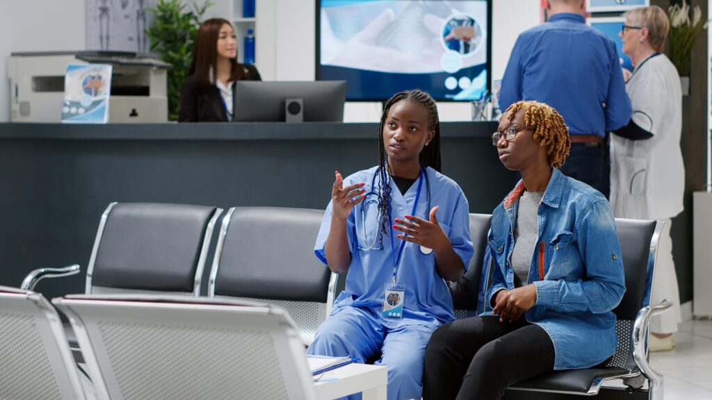 African american nurse and patient using medical hologram