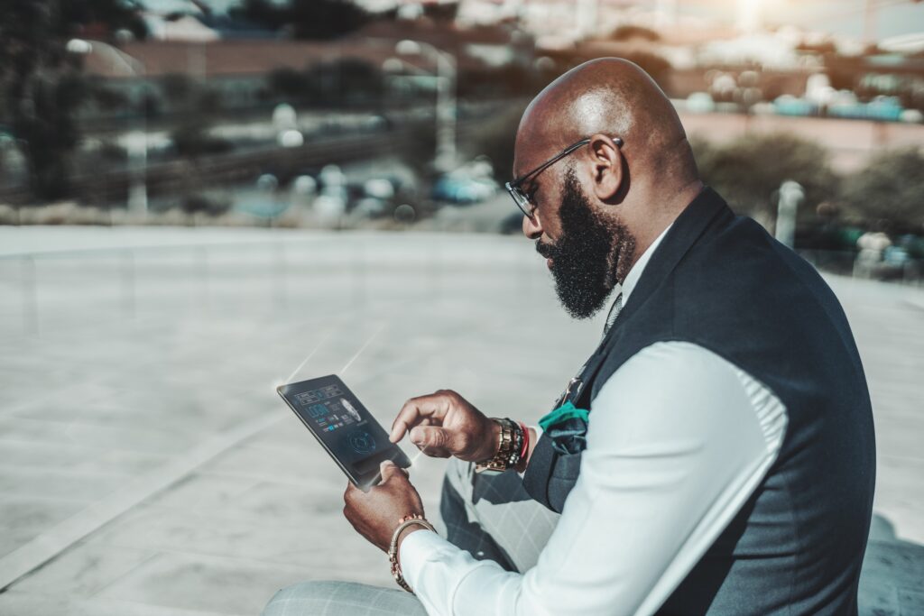 Black guy with a futuristic gadget