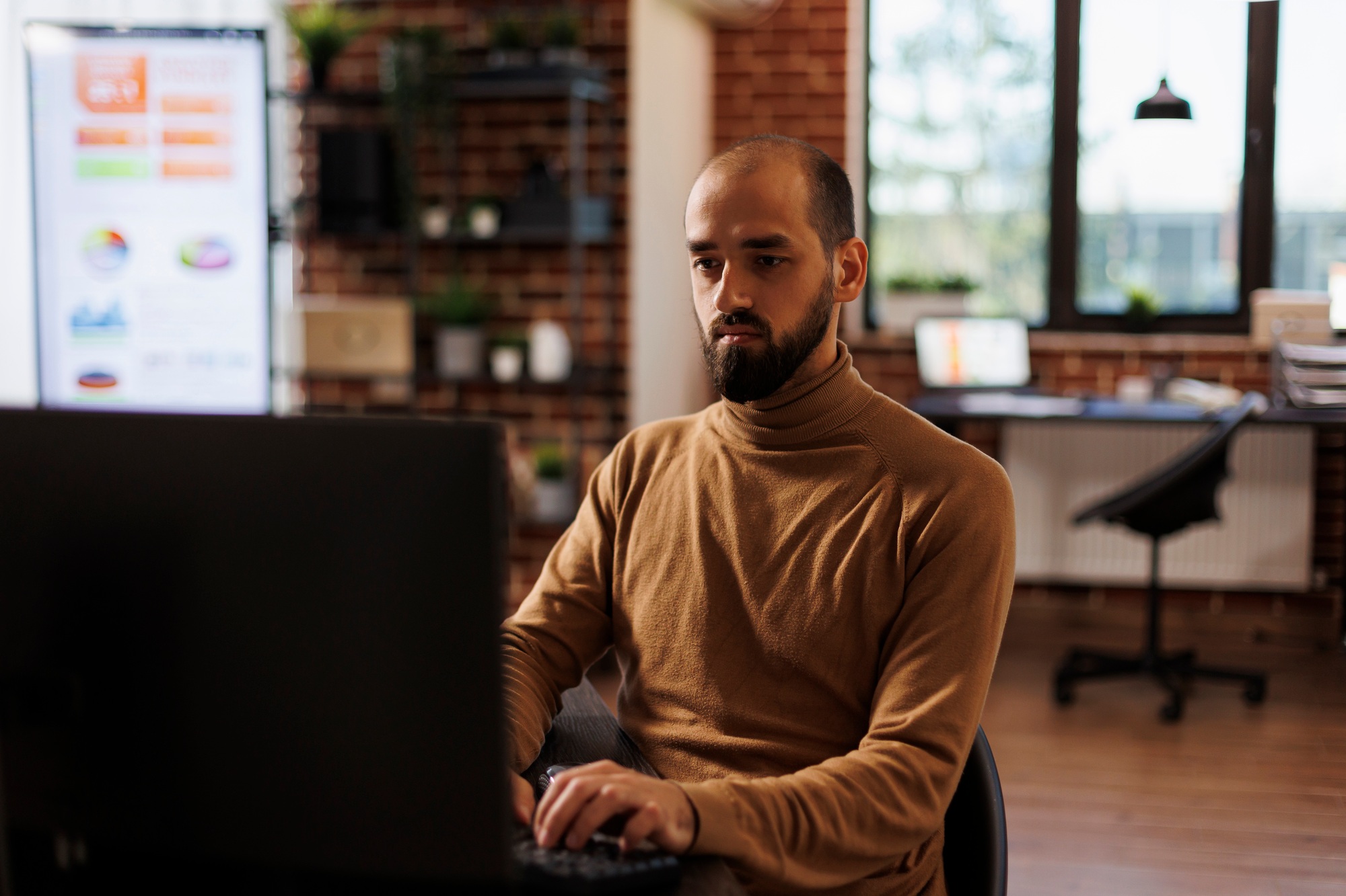 Development agency office worker analyzing project sales and fintech startup