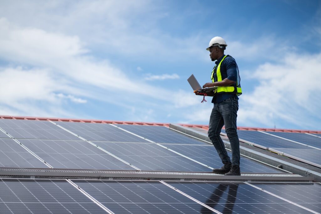 Engineer worker install solar panel. Clean energy concept.