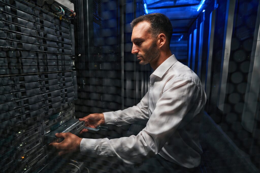 Handsome European technician worker operating with telecommunications