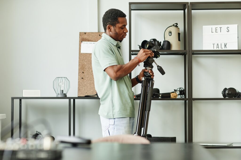 Male Filmmaker Choosing Gear