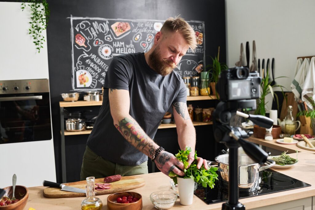 Man Cooing Delicious Meal On Camera