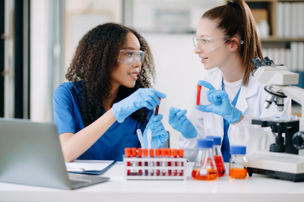 Two scientist or medical technician working, having a medical discuss meeting