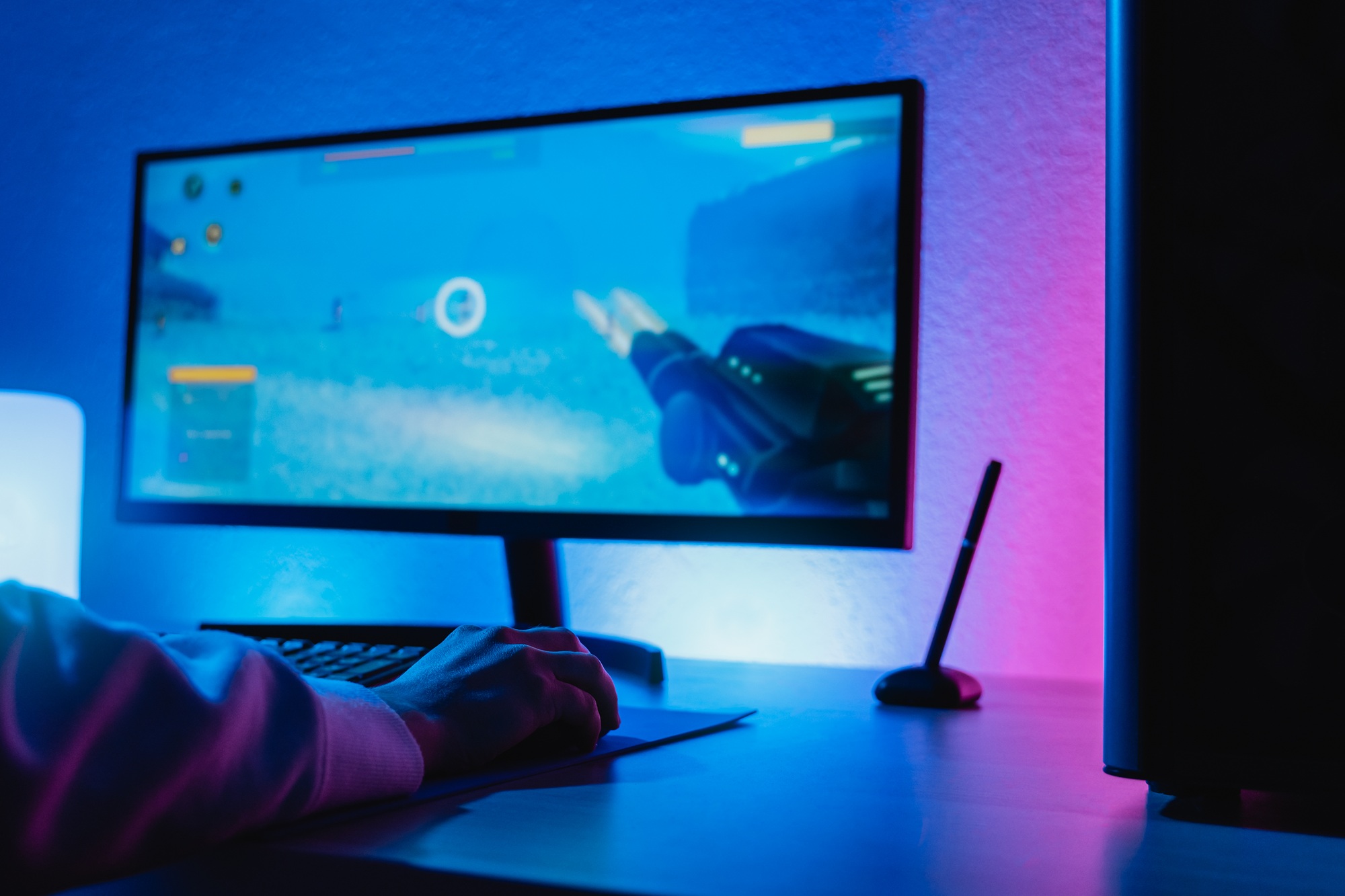 The New Era of Gaming: What You Need to Know About Costs, Tech, and Trends young gamer streaming shooter online video game technology trends concept focus on hand