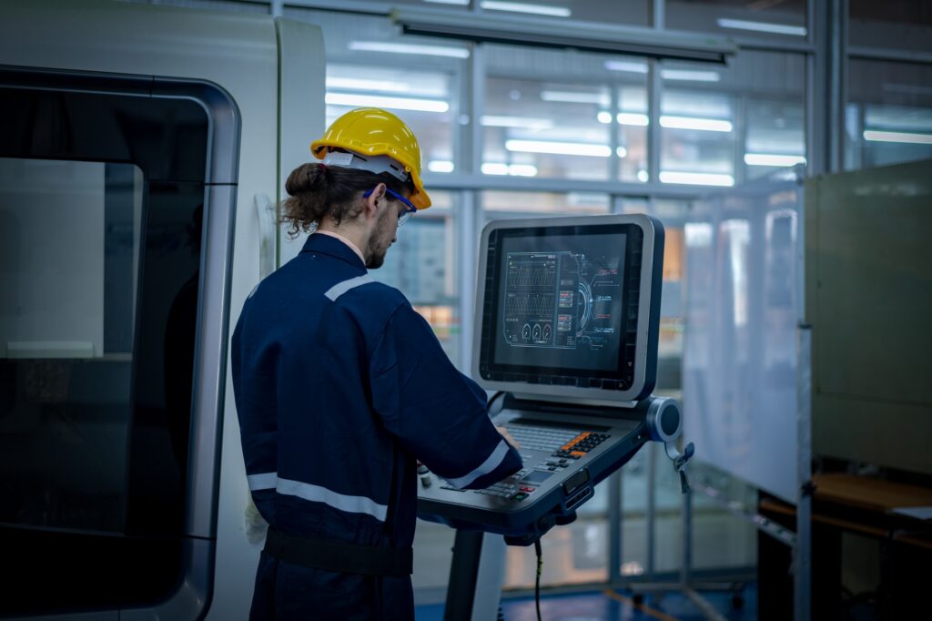 Engineer technician under control digital factory production technology showing automation manufactu