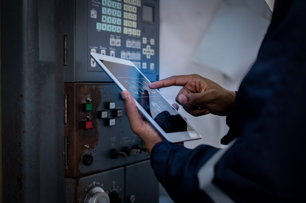 Engineer technician under control digital factory production technology showing automation manufactu