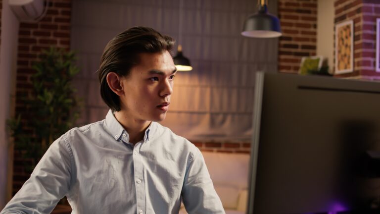 Office worker taking notes on document to plan economic report