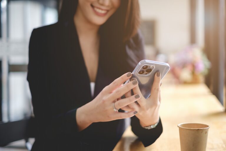 A business woman completes KYC using an online banking program in order to open a digital savings