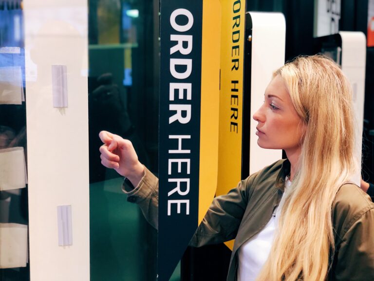 Beautiful blonde girl ordering mcdonald's online