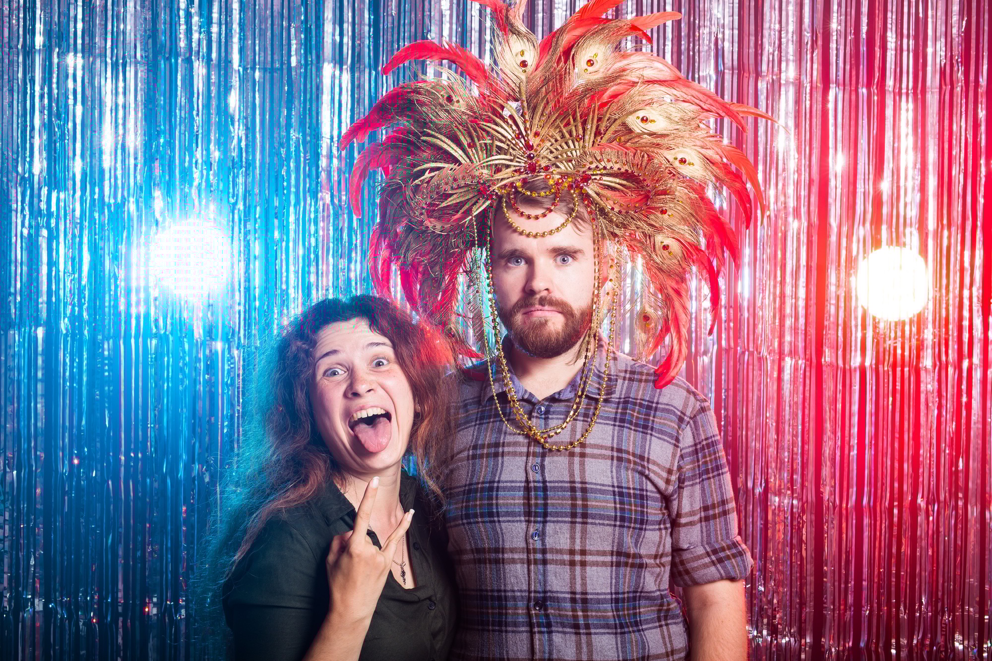 fun, holiday, april fools day and strange people concept crazy young woman and funny man in